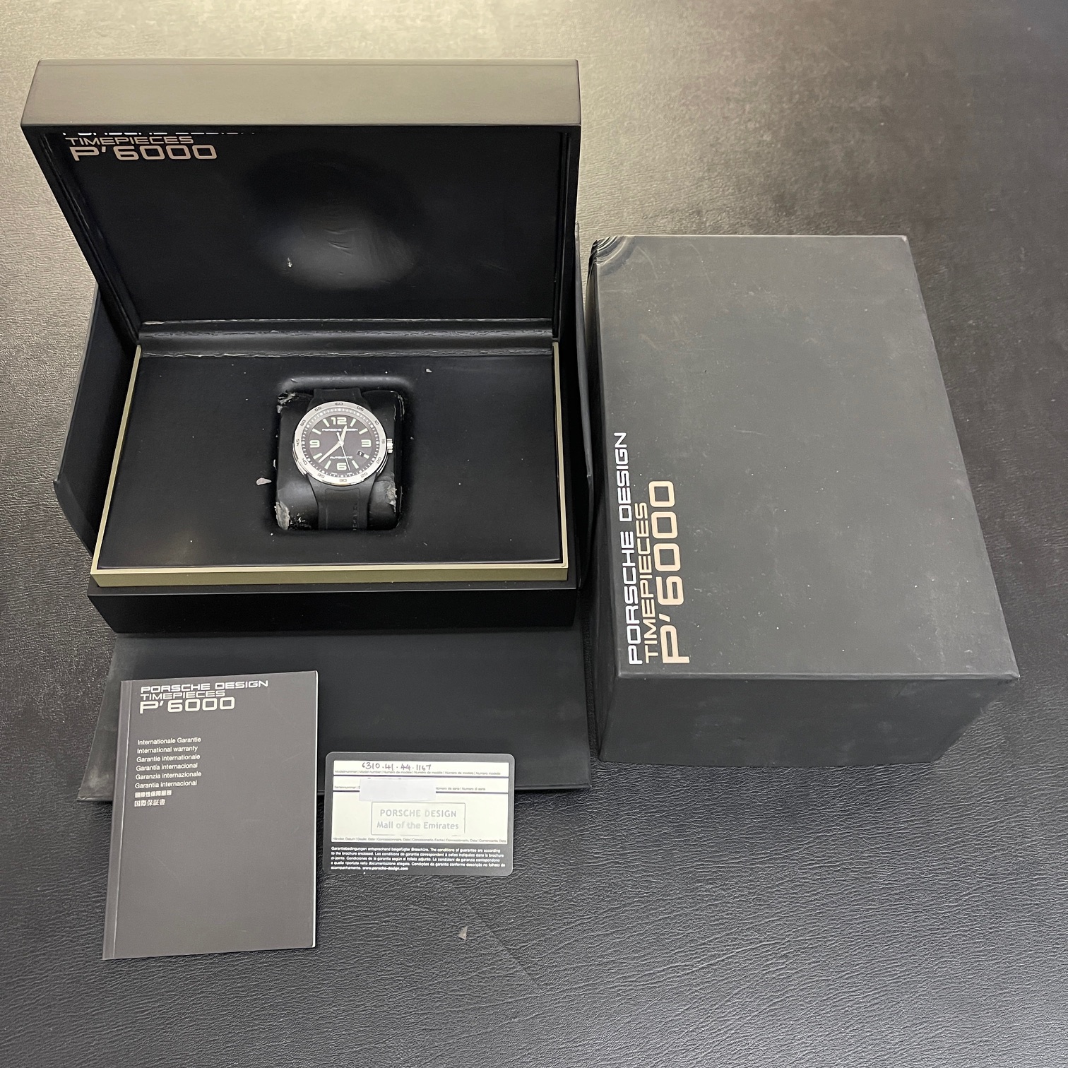 Porsche Herstellerbox mit Ersteinkaufsrechnung und  Garantiekarte einer gebrauchten Luxusuhr