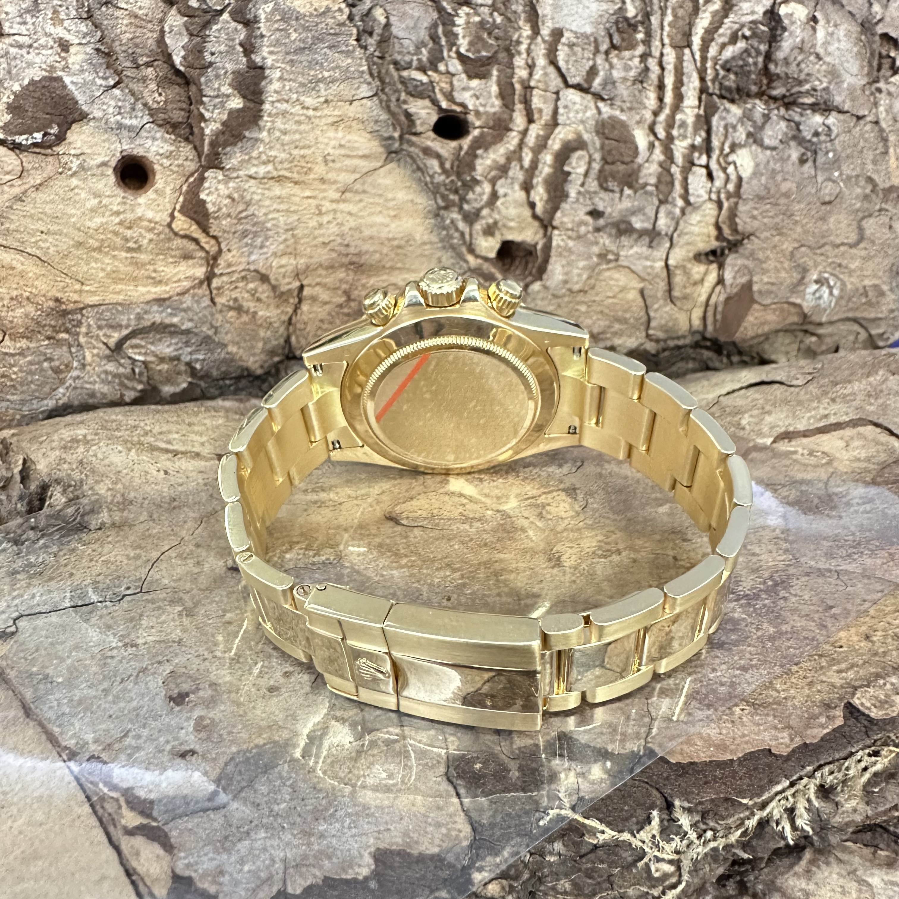 Rolex - Daytona - FULLSET - Ref. 116528-Gelbgold 750, Gebraucht in sehr guter Zustand mit schwarzem Ziferblatt, Faltschließe, Rückseite, Faltschließe aus Gelbgold